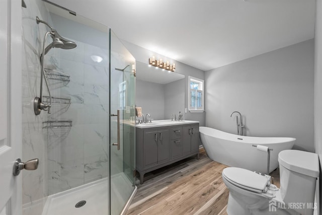41 Haymarket Ct, East Windsor, NJ 08512 - full bath with wood finished floors, a marble finish shower, vanity, and a soaking tub
