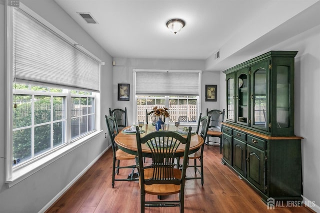41 Haymarket Ct, East Windsor, NJ 08512 - dining room with dark wood-style flooring and baseboards