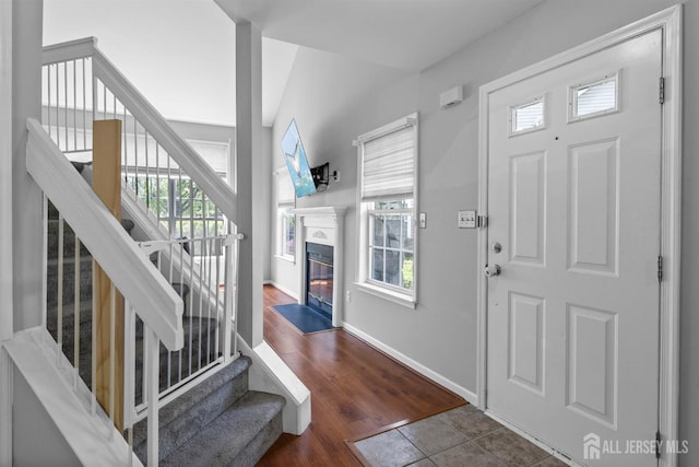 41 Haymarket Ct, East Windsor, NJ 08512 - entrance foyer with stairway, healthy amount of natural light, and a fireplace with flush hearth