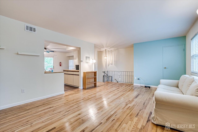 47 Judson St Unit 12B, Edison, NJ 08837 - living room featuring light wood-style floors, baseboards, and ceiling fan
