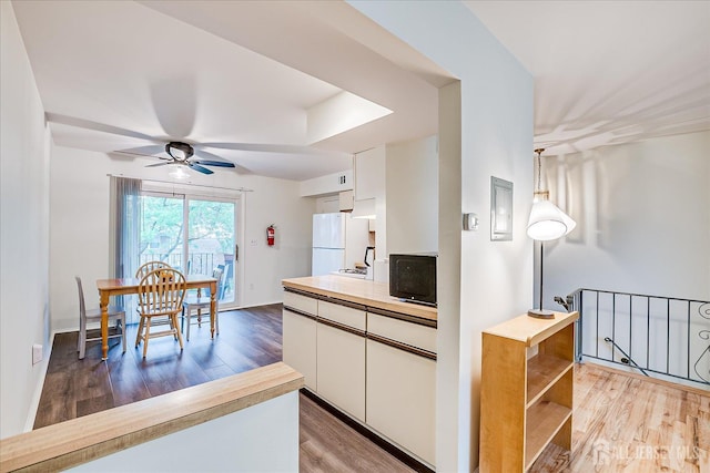47 Judson St Unit 12B, Edison, NJ 08837 - kitchen with freestanding refrigerator, light wood-style floors, white cabinetry, a ceiling fan, and open shelves