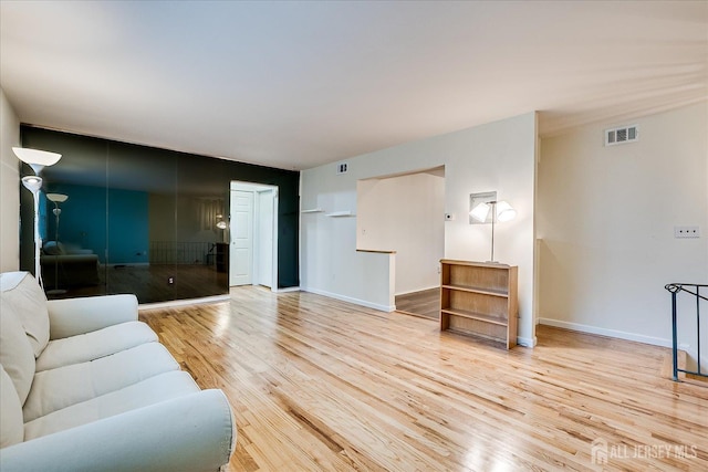living area featuring wood finished floors and baseboards