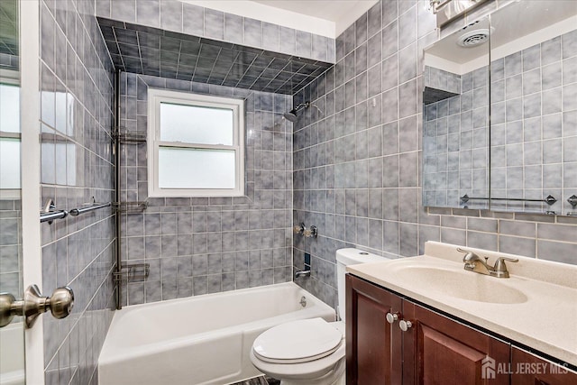 47 Judson St Unit 12B, Edison, NJ 08837 - bathroom featuring toilet, vanity, shower / bathtub combination, and tile walls