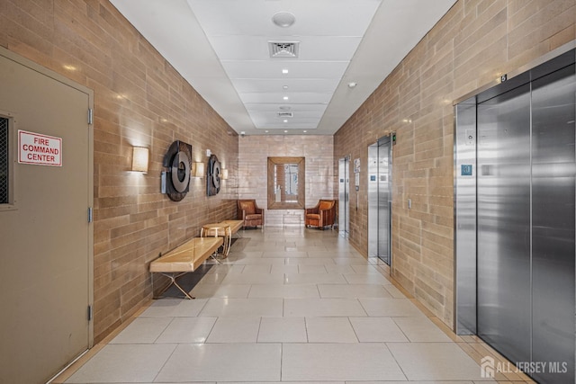 110 Somerset St Unit 2114, New Brunswick, NJ 08901 - hall featuring elevator, light tile patterned floors, and tile walls