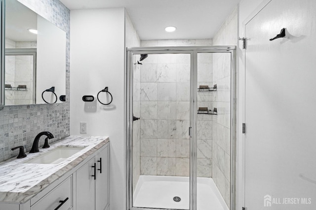 110 Somerset St Unit 2114, New Brunswick, NJ 08901 - bathroom with vanity, a stall shower, tasteful backsplash, and recessed lighting