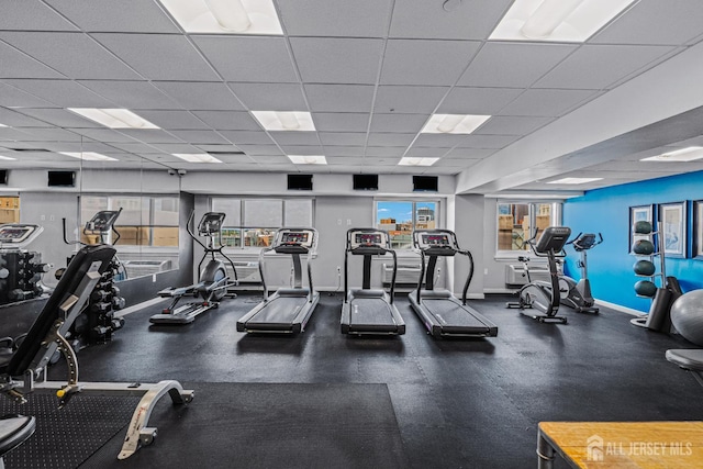110 Somerset St Unit 2114, New Brunswick, NJ 08901 - workout area with a paneled ceiling and baseboards