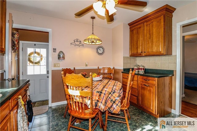 dining space with ceiling fan