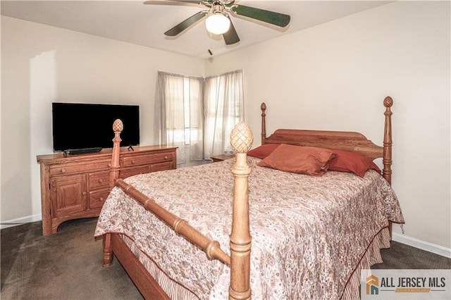 bedroom featuring dark colored carpet and ceiling fan