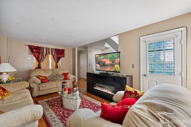 816 Harbortown Blvd Unit 816, Perth Amboy, NJ 08861 - living area featuring wood finished floors and a glass covered fireplace