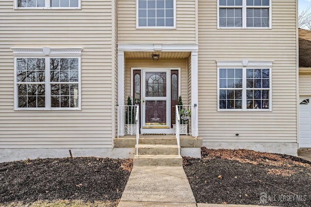 property entrance featuring a garage