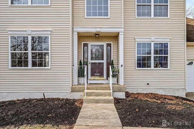 property entrance featuring a garage