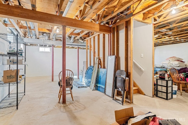 basement featuring stairs