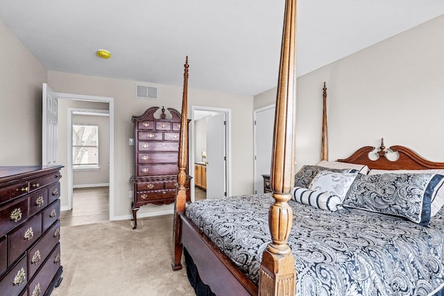 bedroom with visible vents, baseboards, and light colored carpet