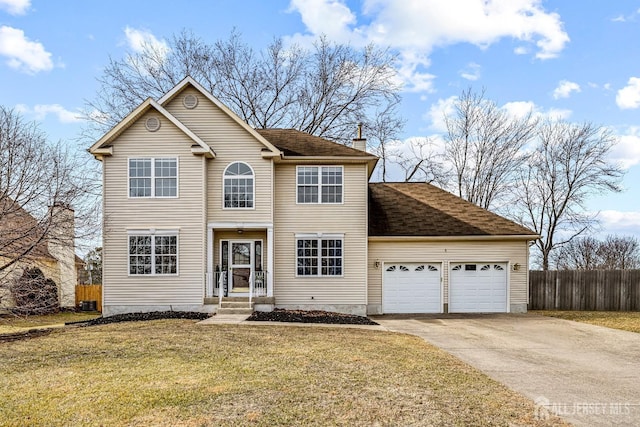 view of front of property featuring a front yard, fence, driveway, an attached garage, and a chimney