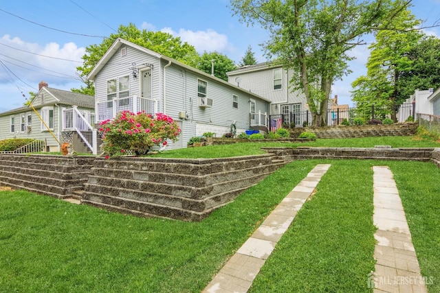 exterior space with a yard and fence