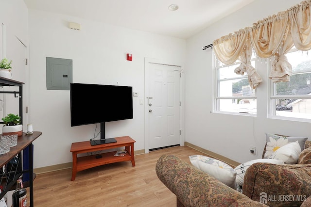 440 Bruck Ave, Perth Amboy, NJ 08861 - living area with electric panel, plenty of natural light, and light wood finished floors