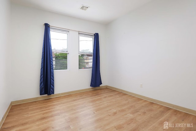 440 Bruck Ave, Perth Amboy, NJ 08861 - unfurnished room featuring light wood finished floors and baseboards