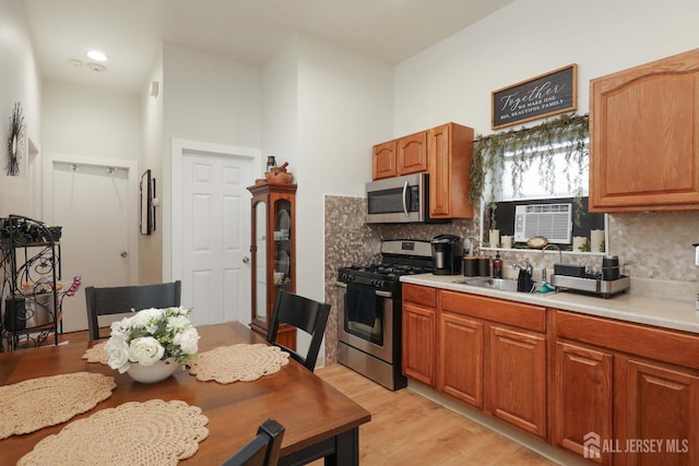 440 Bruck Ave, Perth Amboy, NJ 08861 - kitchen with appliances with stainless steel finishes, decorative backsplash, cooling unit, and light countertops