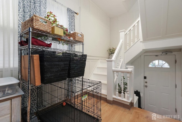440 Bruck Ave, Perth Amboy, NJ 08861 - entryway featuring wood finished floors, a decorative wall, and stairs