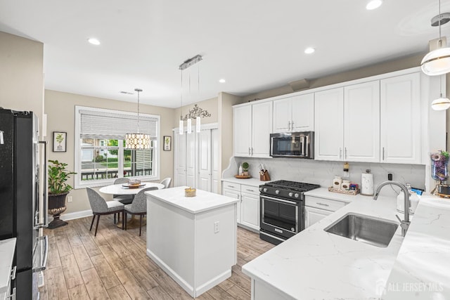 6 Traditions Pl, Monroe, NJ 08831 - kitchen featuring stainless steel microwave, high end black range oven, white cabinets, and recessed lighting
