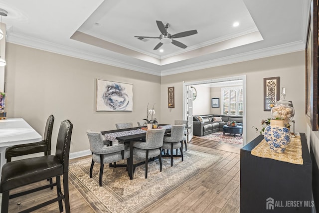 6 Traditions Pl, Monroe, NJ 08831 - dining space featuring ceiling fan, a raised ceiling, light wood-style flooring, ornamental molding, and recessed lighting