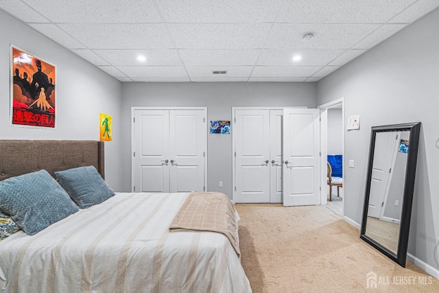 6 Traditions Pl, Monroe, NJ 08831 - bedroom with multiple closets, carpet, a paneled ceiling, and recessed lighting