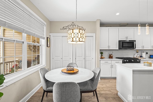 6 Traditions Pl, Monroe, NJ 08831 - kitchen featuring black appliances, white cabinetry, plenty of natural light, and recessed lighting