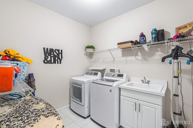 6 Traditions Pl, Monroe, NJ 08831 - laundry area featuring washer and clothes dryer, light tile patterned flooring, and cabinet space