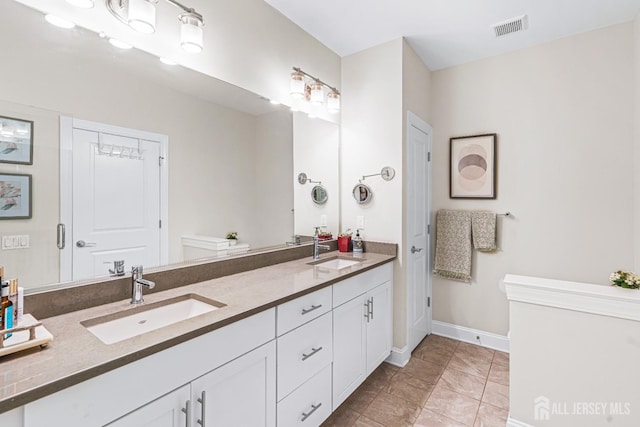 6 Traditions Pl, Monroe, NJ 08831 - bathroom featuring double vanity and tile patterned floors