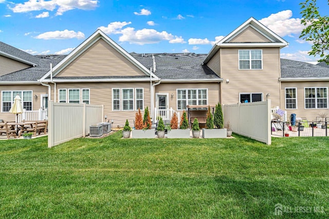 6 Traditions Pl, Monroe, NJ 08831 - rear view of house featuring a patio, a garden, and roof with shingles