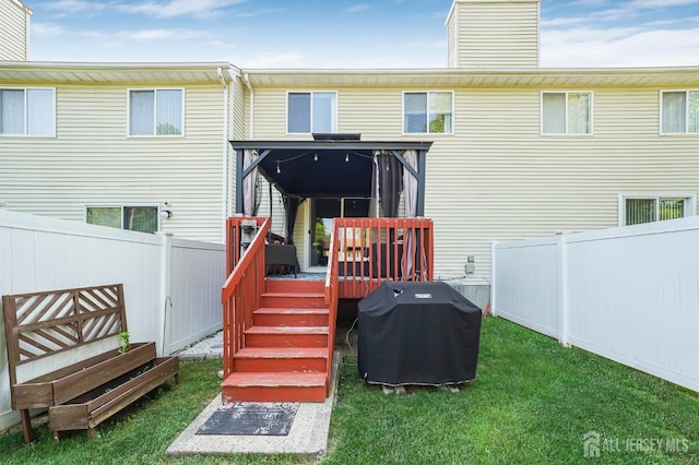 30 Forest Garden Dr, Old Bridge, NJ 07747 - back of house featuring a fenced backyard, a chimney, and a wooden deck