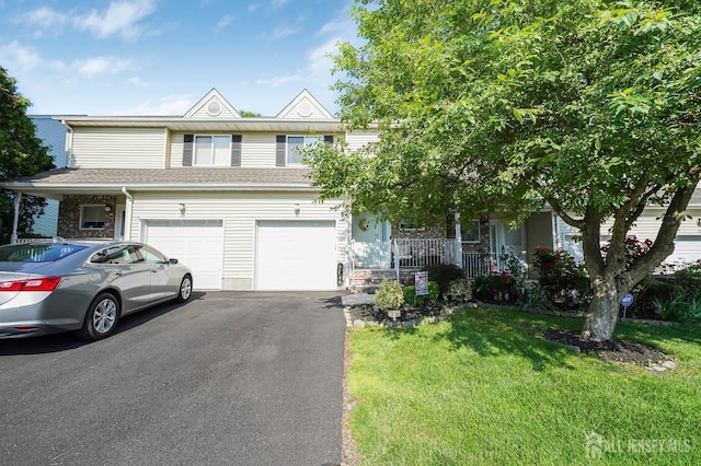 30 Forest Garden Dr, Old Bridge, NJ 07747 - multi unit property with driveway, covered porch, a front lawn, and a garage