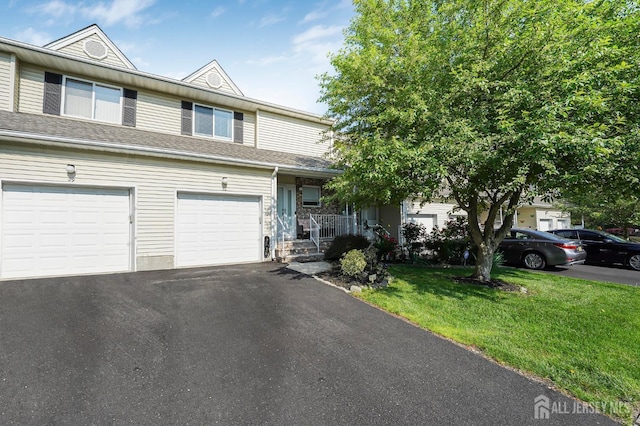 30 Forest Garden Dr, Old Bridge, NJ 07747 - townhome / multi-family property with a front yard, asphalt driveway, and a porch