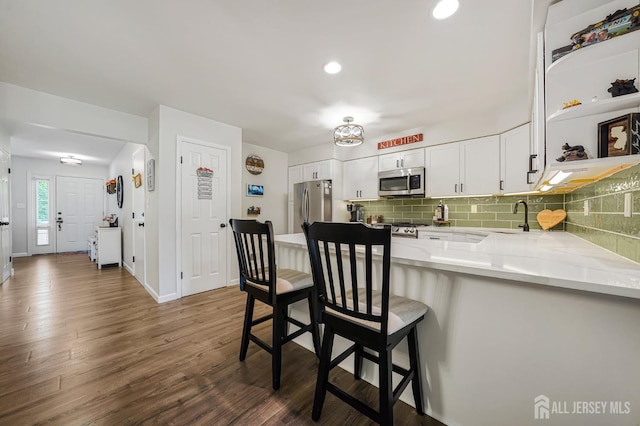 30 Forest Garden Dr, Old Bridge, NJ 07747 - kitchen with stainless steel appliances, light stone counters, white cabinetry, decorative backsplash, and recessed lighting