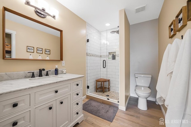 30 Forest Garden Dr, Old Bridge, NJ 07747 - full bathroom with wood finished floors, a shower stall, vanity, and recessed lighting