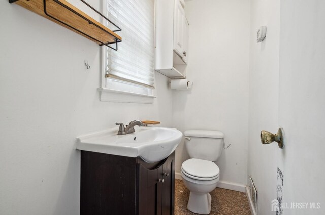 9 Merion Dr, Manalapan, NJ 07726 - half bath featuring vanity, toilet, and baseboards