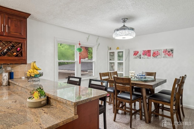 9 Merion Dr, Manalapan, NJ 07726 - dining room featuring a textured ceiling