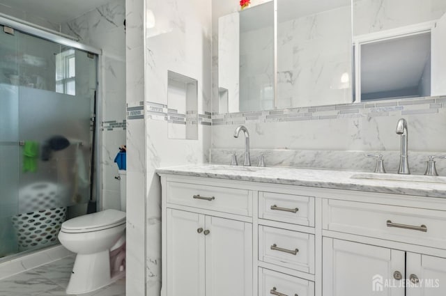 9 Merion Dr, Manalapan, NJ 07726 - full bath featuring tile walls, double vanity, marble look tiles, a shower stall, and toilet