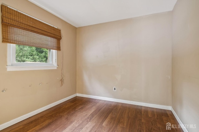 9 Merion Dr, Manalapan, NJ 07726 - empty room featuring wood finished floors and baseboards