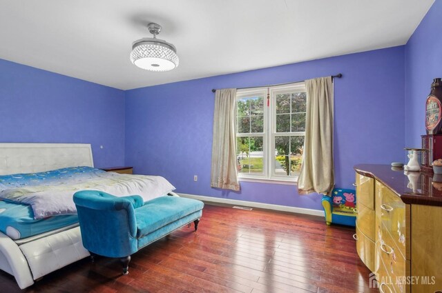 9 Merion Dr, Manalapan, NJ 07726 - bedroom with baseboards and hardwood / wood-style floors