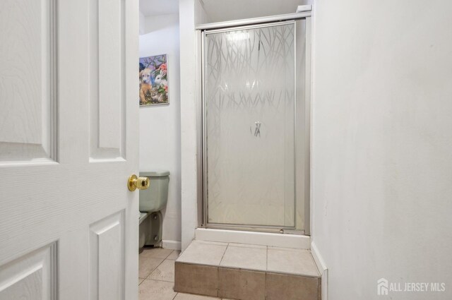 9 Merion Dr, Manalapan, NJ 07726 - bathroom featuring tile patterned floors, a shower stall, toilet, and baseboards