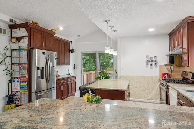 9 Merion Dr, Manalapan, NJ 07726 - kitchen featuring stainless steel appliances, light stone counters, a textured ceiling, backsplash, and lofted ceiling