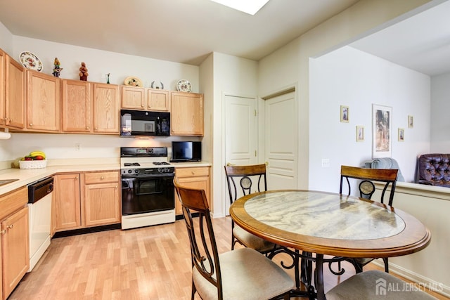 543 Waterside Blvd, Monroe, NJ 08831 - kitchen featuring black microwave, gas range gas stove, dishwashing machine, light wood-style flooring, and light brown cabinetry