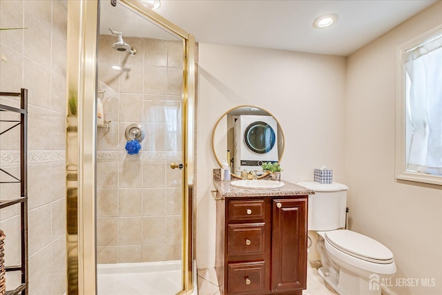 full bath featuring toilet, vanity, tile patterned floors, and a stall shower