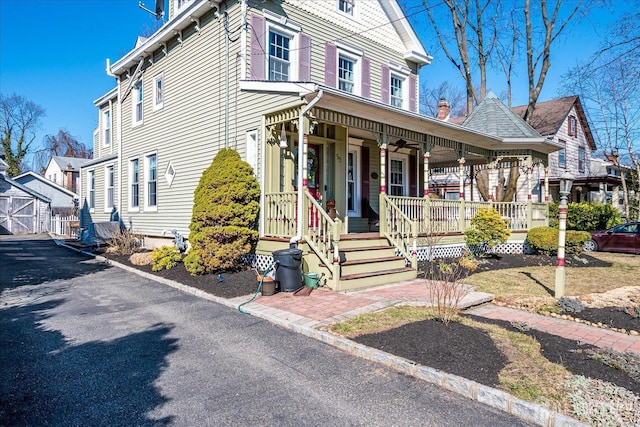 view of front of house with a porch and ceiling fan