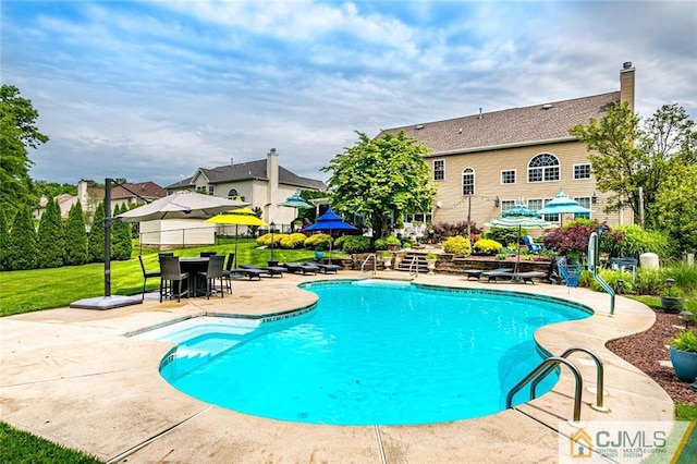 view of swimming pool with a patio area