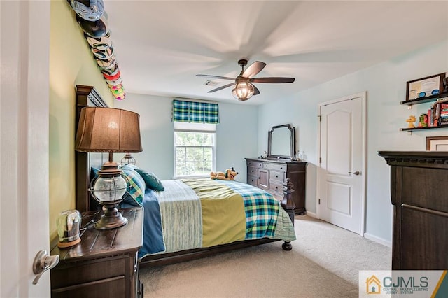 carpeted bedroom featuring ceiling fan