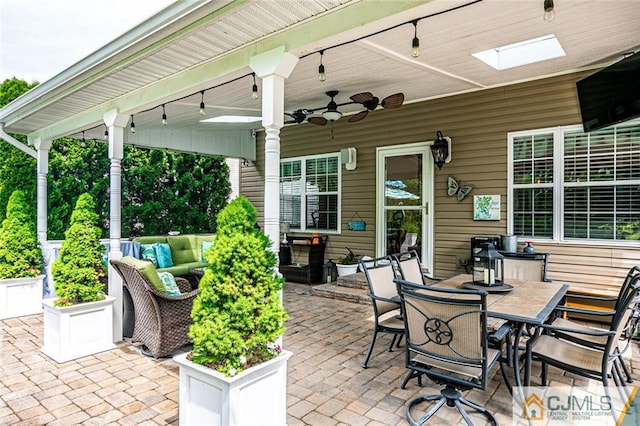 view of patio / terrace with an outdoor living space and ceiling fan