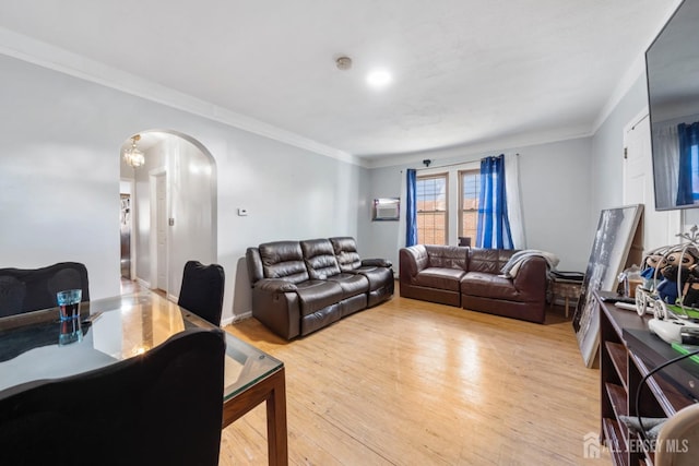 living room featuring light hardwood / wood-style flooring and ornamental molding