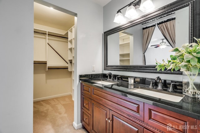 362 Aldeburgh Ave, Franklin Twsp, NJ 08873 - full bathroom with double vanity, baseboards, and a walk in closet